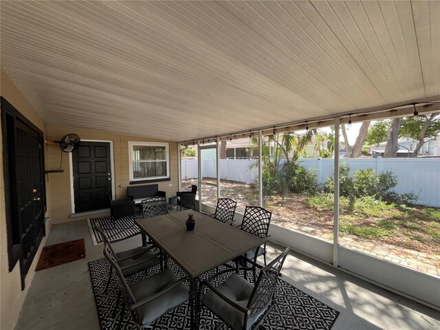 422 Crosswinds Dr, Palm Harbor, FL 34683 - sunroom with outdoor dining space