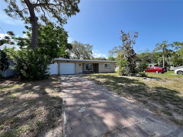 422 Crosswinds Dr, Palm Harbor, FL 34683 - single story home featuring asphalt driveway and an attached garage