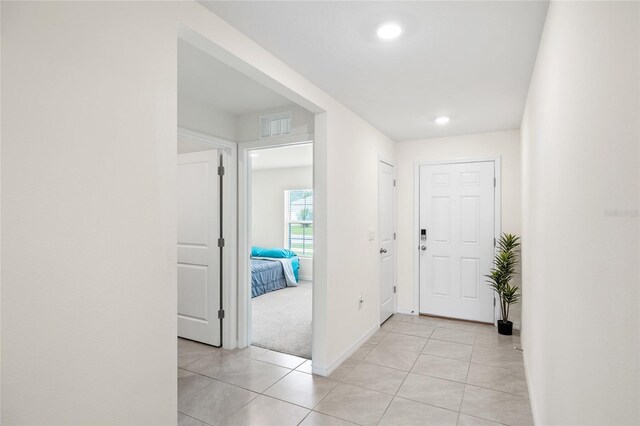 10452 Elgin Blvd, Spring Hill, FL 34608 - foyer with baseboards, light tile patterned flooring, and recessed lighting