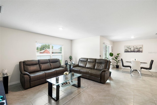 10452 Elgin Blvd, Spring Hill, FL 34608 - living area featuring light tile patterned flooring, recessed lighting, and baseboards