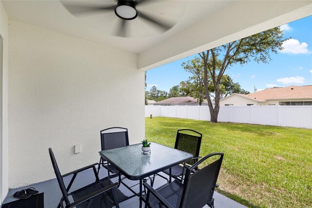 10452 Elgin Blvd, Spring Hill, FL 34608 - view of patio featuring outdoor dining space and ceiling fan