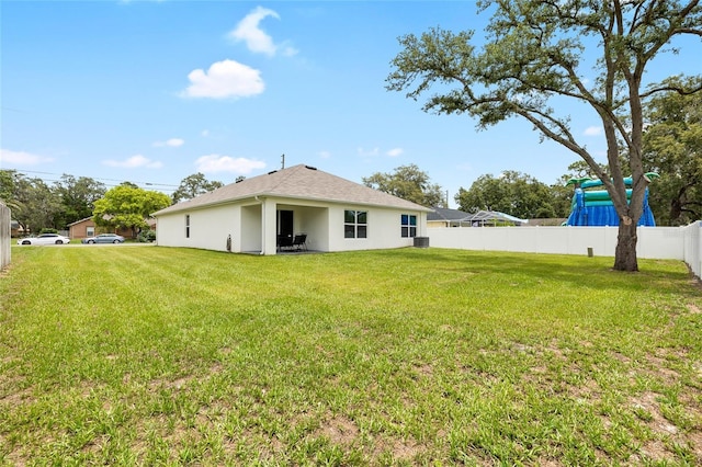 10452 Elgin Blvd, Spring Hill, FL 34608 - rear view of property featuring stucco siding and central air condition unit