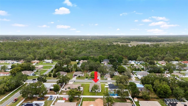 10452 Elgin Blvd, Spring Hill, FL 34608 - aerial view of property and surrounding area with a heavily wooded area and nearby suburban area