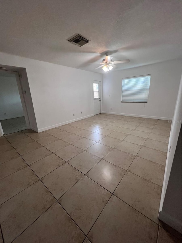 226 Thorn Tree Pl Unit 226, Brandon, FL 33510 - spare room with light tile patterned floors, ceiling fan, and baseboards