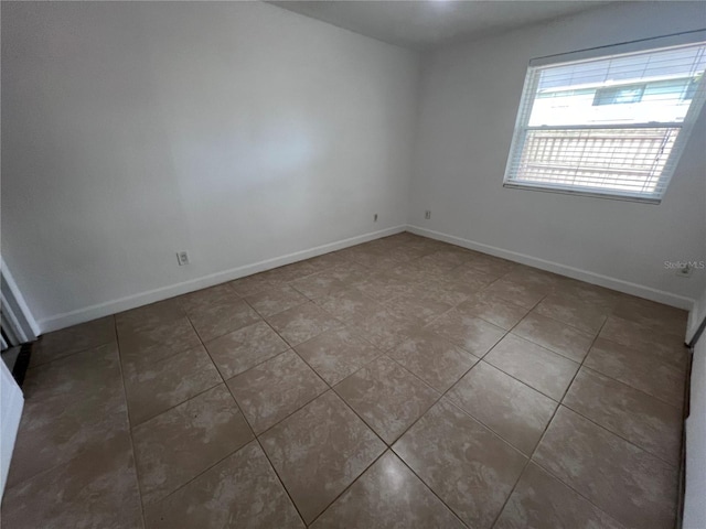 226 Thorn Tree Pl Unit 226, Brandon, FL 33510 - spare room featuring baseboards and tile patterned floors