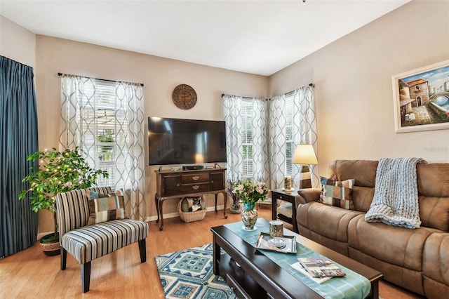 3484 Primrose Way, Palm Harbor, FL 34683 - living area with healthy amount of natural light and wood finished floors