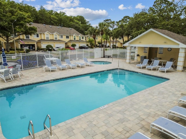3484 Primrose Way, Palm Harbor, FL 34683 - community pool featuring a patio, a residential view, and a hot tub