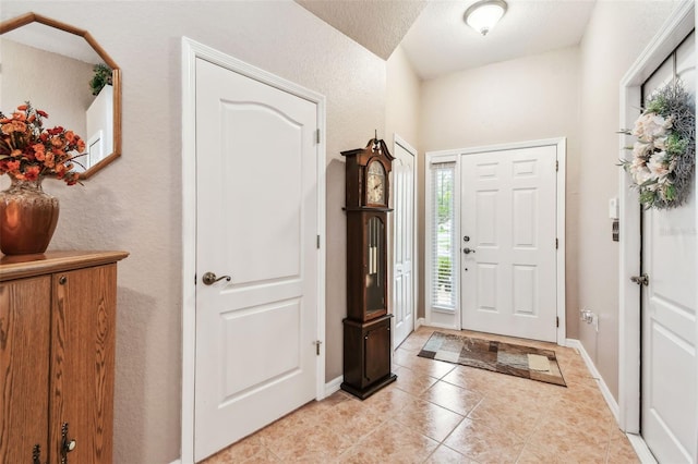 3484 Primrose Way, Palm Harbor, FL 34683 - foyer featuring light tile patterned floors and baseboards