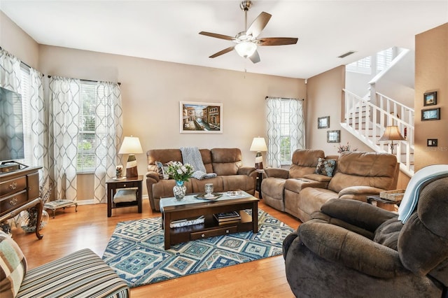 3484 Primrose Way, Palm Harbor, FL 34683 - living room with healthy amount of natural light, wood finished floors, and a ceiling fan