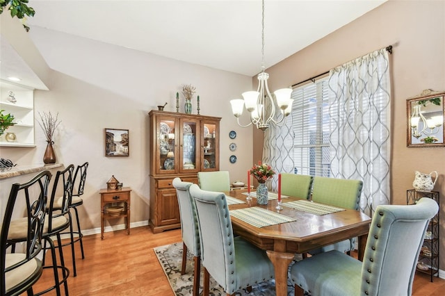 3484 Primrose Way, Palm Harbor, FL 34683 - dining space with a chandelier and light wood-type flooring