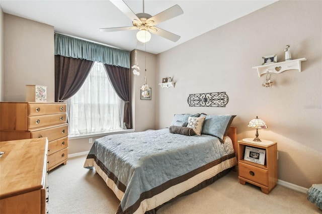 3484 Primrose Way, Palm Harbor, FL 34683 - bedroom with light carpet and a ceiling fan