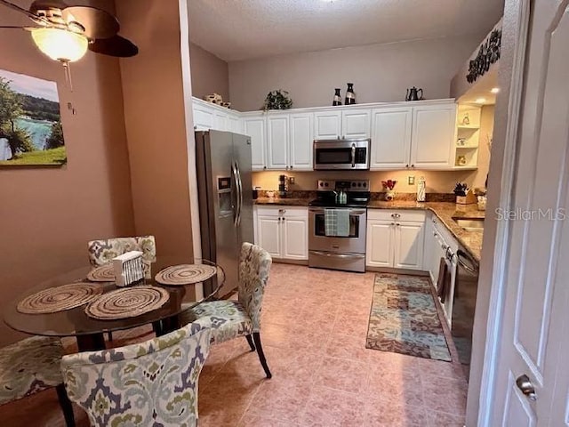 3484 Primrose Way, Palm Harbor, FL 34683 - kitchen with stainless steel appliances, white cabinetry, and open shelves