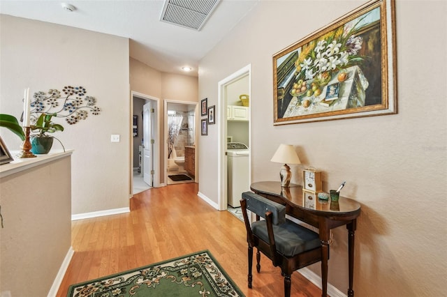 3484 Primrose Way, Palm Harbor, FL 34683 - hallway with light wood-style floors and baseboards