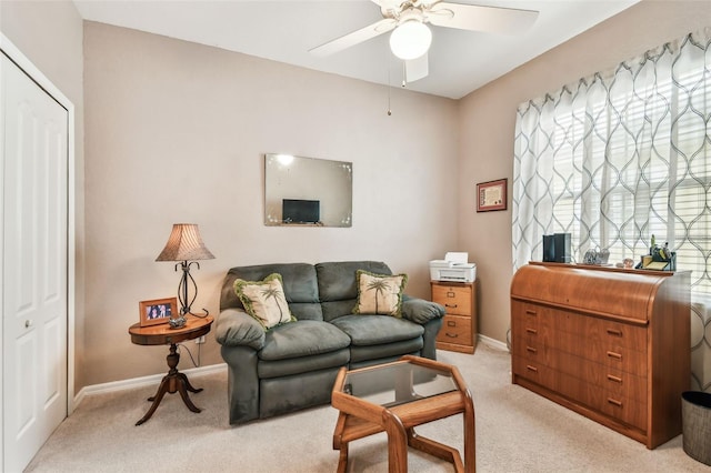 3484 Primrose Way, Palm Harbor, FL 34683 - living area featuring ceiling fan and light colored carpet