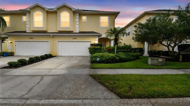 3484 Primrose Way, Palm Harbor, FL 34683 - view of property featuring stucco siding, concrete driveway, and an attached garage