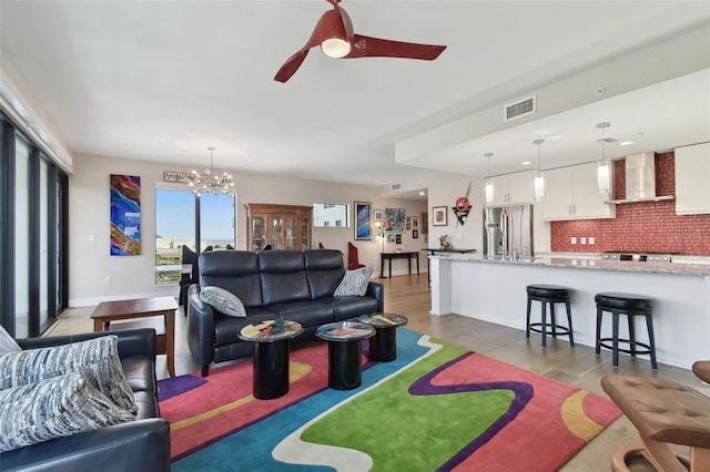 199 Dali Blvd Unit 607, Saint Petersburg, FL 33701 - living area featuring a chandelier, wood finished floors, and a ceiling fan