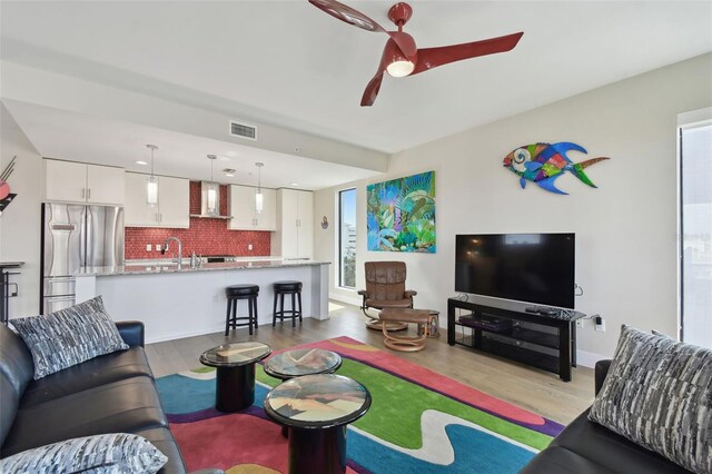 199 Dali Blvd Unit 607, Saint Petersburg, FL 33701 - living area with wood finished floors and a ceiling fan