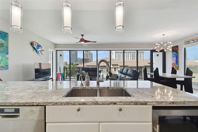 199 Dali Blvd Unit 607, Saint Petersburg, FL 33701 - kitchen featuring a sink, beverage cooler, dishwasher, and light stone countertops