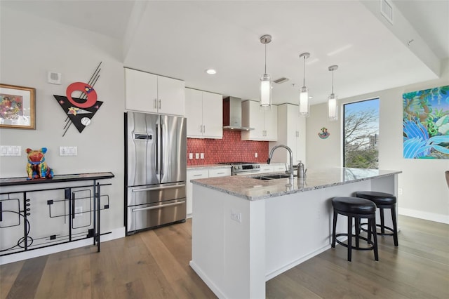199 Dali Blvd Unit 607, Saint Petersburg, FL 33701 - kitchen featuring appliances with stainless steel finishes, a sink, wall chimney exhaust hood, dark wood-type flooring, and decorative backsplash