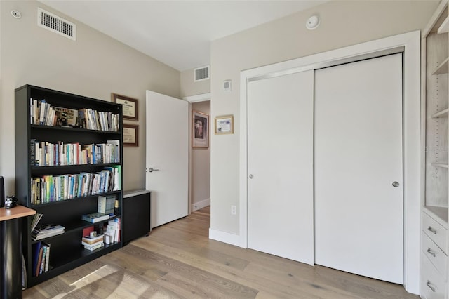 199 Dali Blvd Unit 607, Saint Petersburg, FL 33701 - bedroom with light wood finished floors and a closet