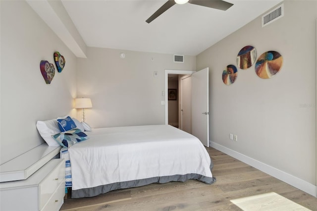 199 Dali Blvd Unit 607, Saint Petersburg, FL 33701 - bedroom featuring light wood-style flooring, baseboards, and a ceiling fan
