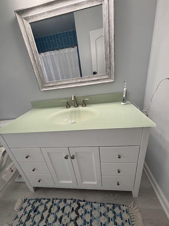 1055 6th Ave Unit A11, Vero Beach, FL 32960 - bathroom with vanity and baseboards