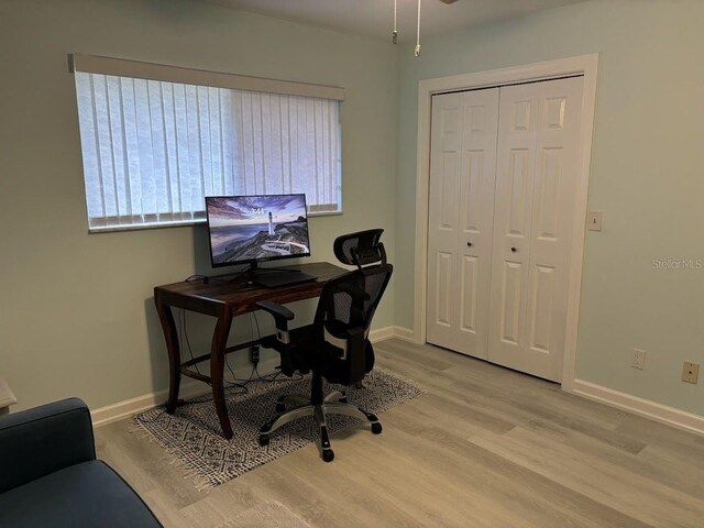 1055 6th Ave Unit A11, Vero Beach, FL 32960 - office area featuring wood finished floors and baseboards