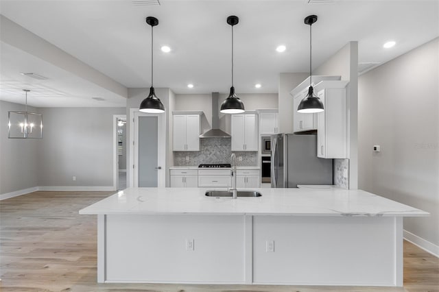 4799 Hickory Oak Loop, Brooksville, FL 34601 - kitchen featuring a sink, wall chimney exhaust hood, baseboards, stainless steel appliances, and white cabinetry