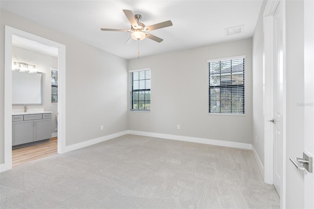 4799 Hickory Oak Loop, Brooksville, FL 34601 - unfurnished bedroom with light colored carpet, baseboards, and a sink