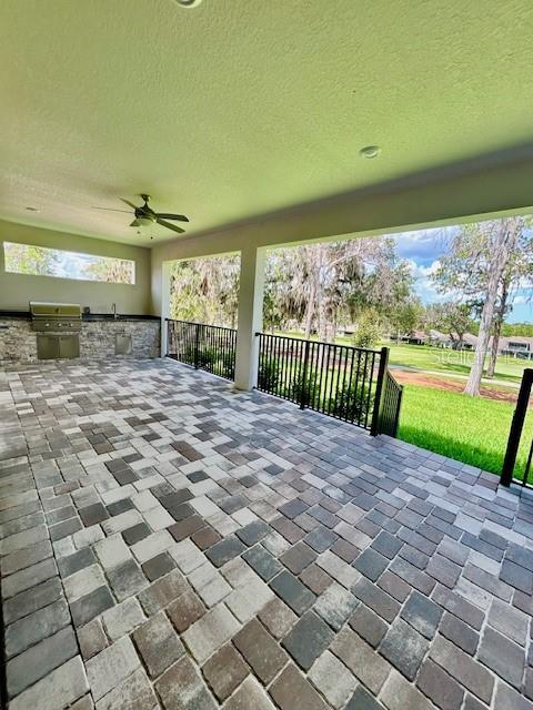 4799 Hickory Oak Loop, Brooksville, FL 34601 - view of patio / terrace with exterior kitchen and ceiling fan