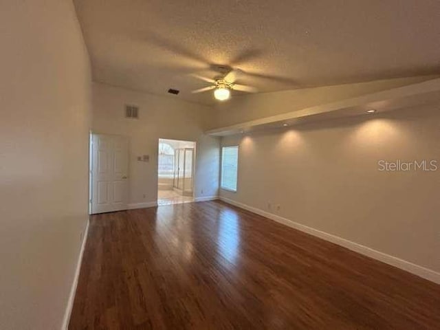 2635 Jarvis Cir, Palm Harbor, FL 34683 - unfurnished room with a ceiling fan, wood finished floors, baseboards, and a textured ceiling