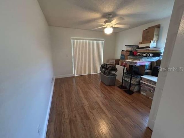 2635 Jarvis Cir, Palm Harbor, FL 34683 - bedroom with wood finished floors, baseboards, and a ceiling fan