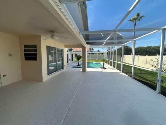 2635 Jarvis Cir, Palm Harbor, FL 34683 - view of patio / terrace featuring ceiling fan and glass enclosure