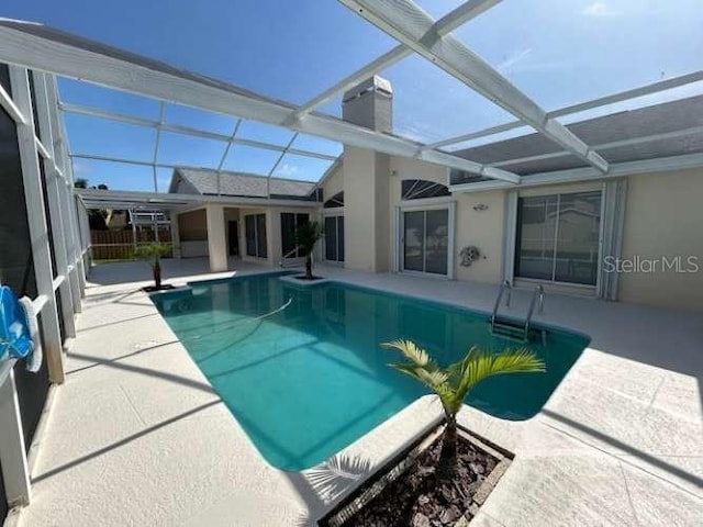 2635 Jarvis Cir, Palm Harbor, FL 34683 - outdoor pool featuring a patio area and a lanai