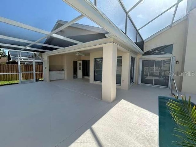 2635 Jarvis Cir, Palm Harbor, FL 34683 - view of patio / terrace featuring glass enclosure and a ceiling fan