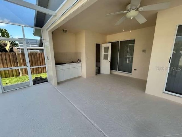 2635 Jarvis Cir, Palm Harbor, FL 34683 - view of patio featuring ceiling fan and a lanai