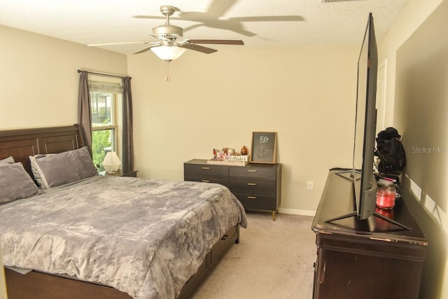 16623 Carlton Pond St, Wimauma, FL 33598 - bedroom featuring light colored carpet and a ceiling fan
