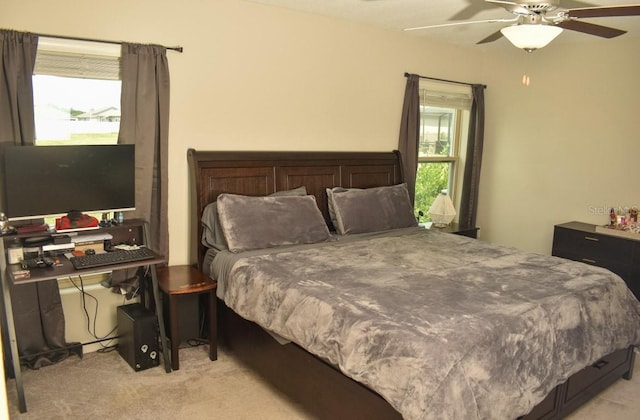 16623 Carlton Pond St, Wimauma, FL 33598 - bedroom with light colored carpet and a ceiling fan