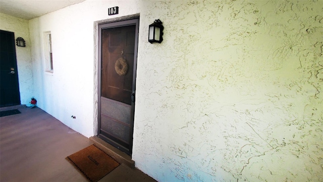 230 N Bayshore Blvd Unit 103, Clearwater, FL 33759 - property entrance with stucco siding