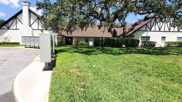 230 N Bayshore Blvd Unit 103, Clearwater, FL 33759 - view of front facade featuring a front lawn