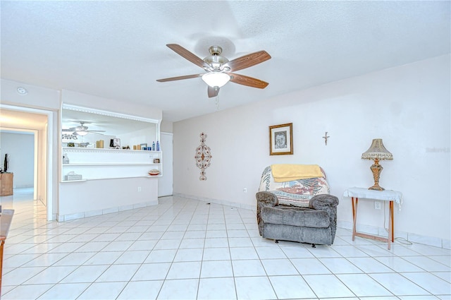 1655 S Highland Ave Unit B118, Clearwater, FL 33756 - living area featuring ceiling fan, a textured ceiling, and light tile patterned floors