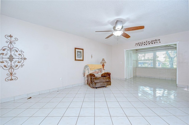 1655 S Highland Ave Unit B118, Clearwater, FL 33756 - living area with a ceiling fan, light tile patterned floors, and a textured ceiling