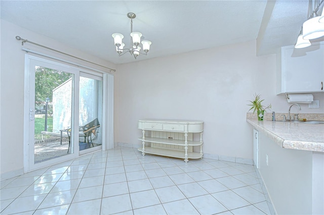 1655 S Highland Ave Unit B118, Clearwater, FL 33756 - dining space featuring a chandelier and light tile patterned flooring