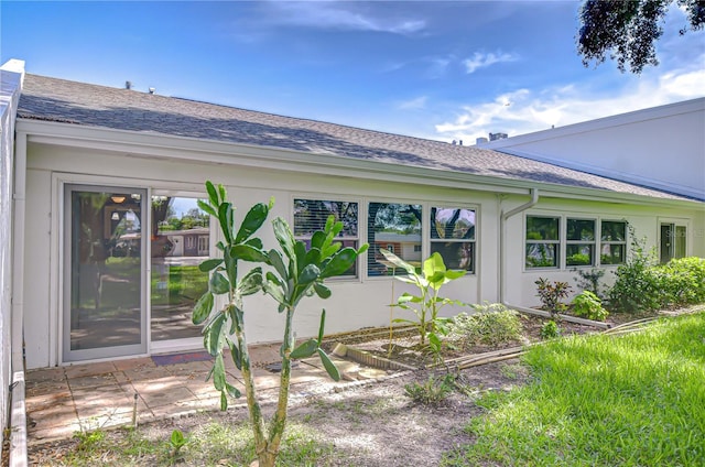 1655 S Highland Ave Unit B118, Clearwater, FL 33756 - view of side of property featuring a shingled roof