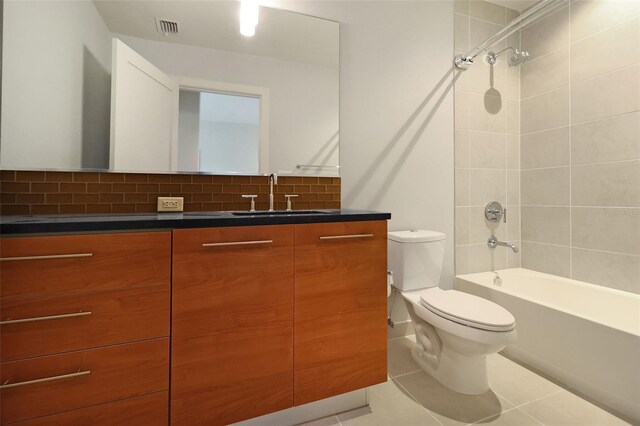 400 4th Ave S Unit 301, Saint Petersburg, FL 33701 - bathroom with toilet, shower / washtub combination, tile patterned flooring, vanity, and backsplash