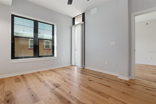 400 4th Ave S Unit 301, Saint Petersburg, FL 33701 - unfurnished bedroom with light wood finished floors, baseboards, and a ceiling fan