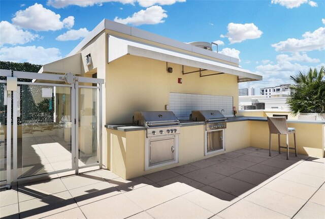 400 4th Ave S Unit 301, Saint Petersburg, FL 33701 - view of patio featuring a bar