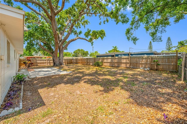 10599 111th Ave N, Largo, FL 33773 - fenced backyard with a patio area