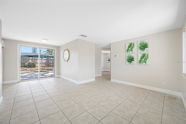 10599 111th Ave N, Largo, FL 33773 - unfurnished room with light tile patterned flooring and baseboards