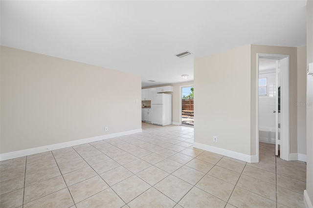 10599 111th Ave N, Largo, FL 33773 - unfurnished room with light tile patterned flooring and baseboards